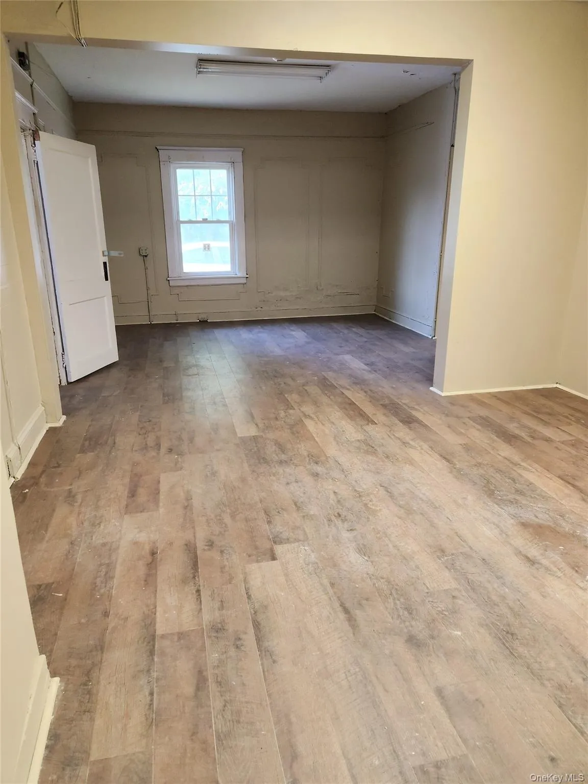 Spare room featuring light wood-style flooring Spare room featuring light wood-style flooring
