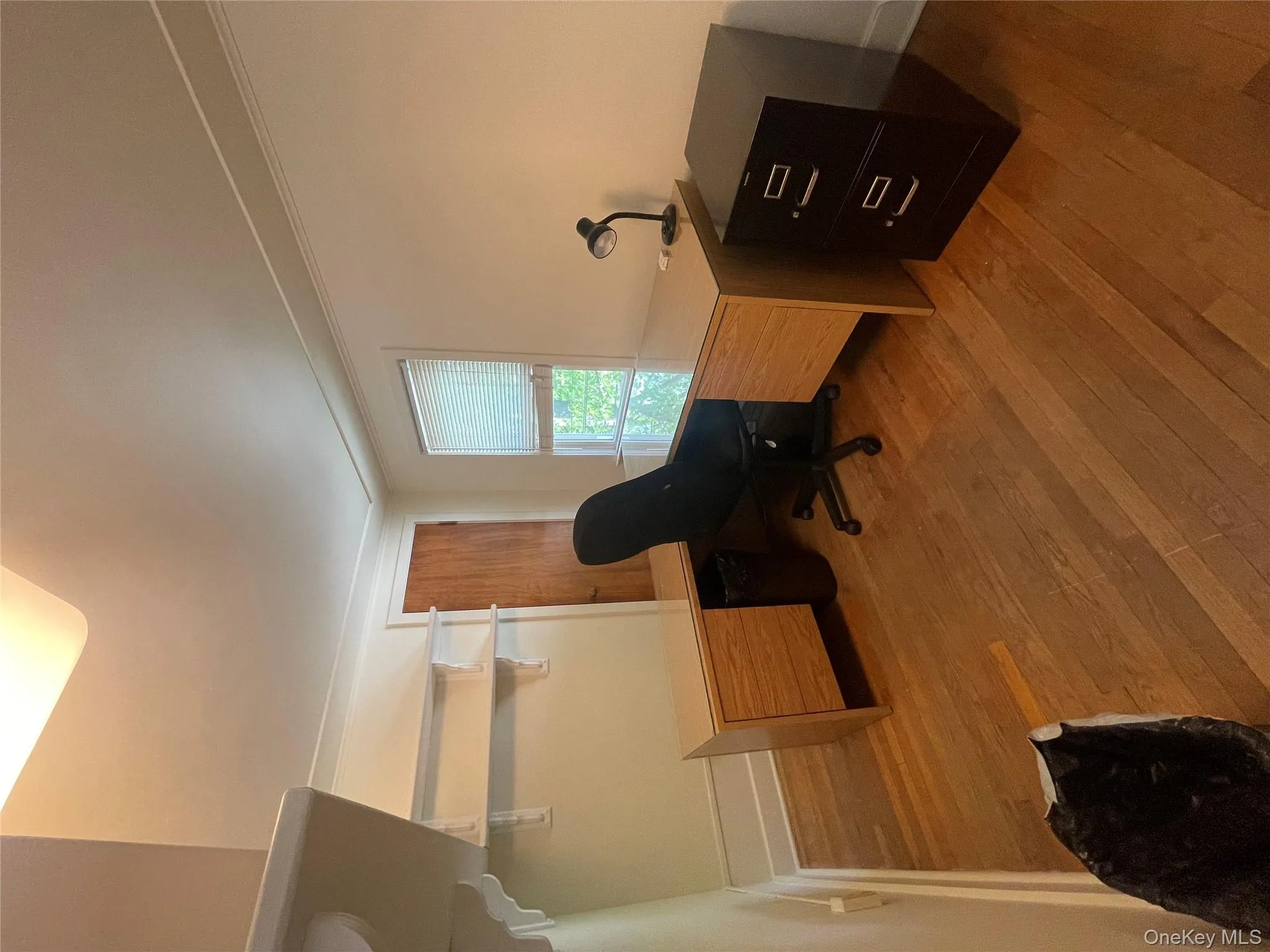 # 1. Main office featuring light wood-style flooring and crown molding # 1. Main office featuring light wood-style flooring and crown molding