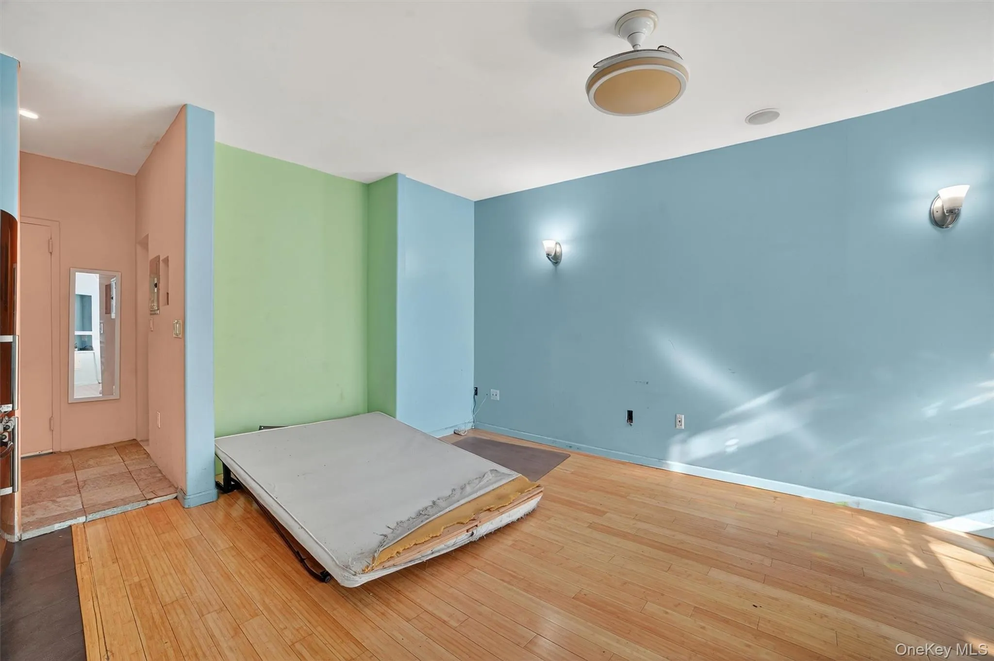 Unfurnished bedroom featuring light wood-style flooring and baseboards Unfurnished bedroom featuring light wood-style flooring and baseboards