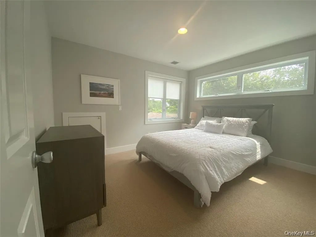 Carpeted bedroom featuring baseboards and recessed lighting Carpeted bedroom featuring baseboards and recessed lighting