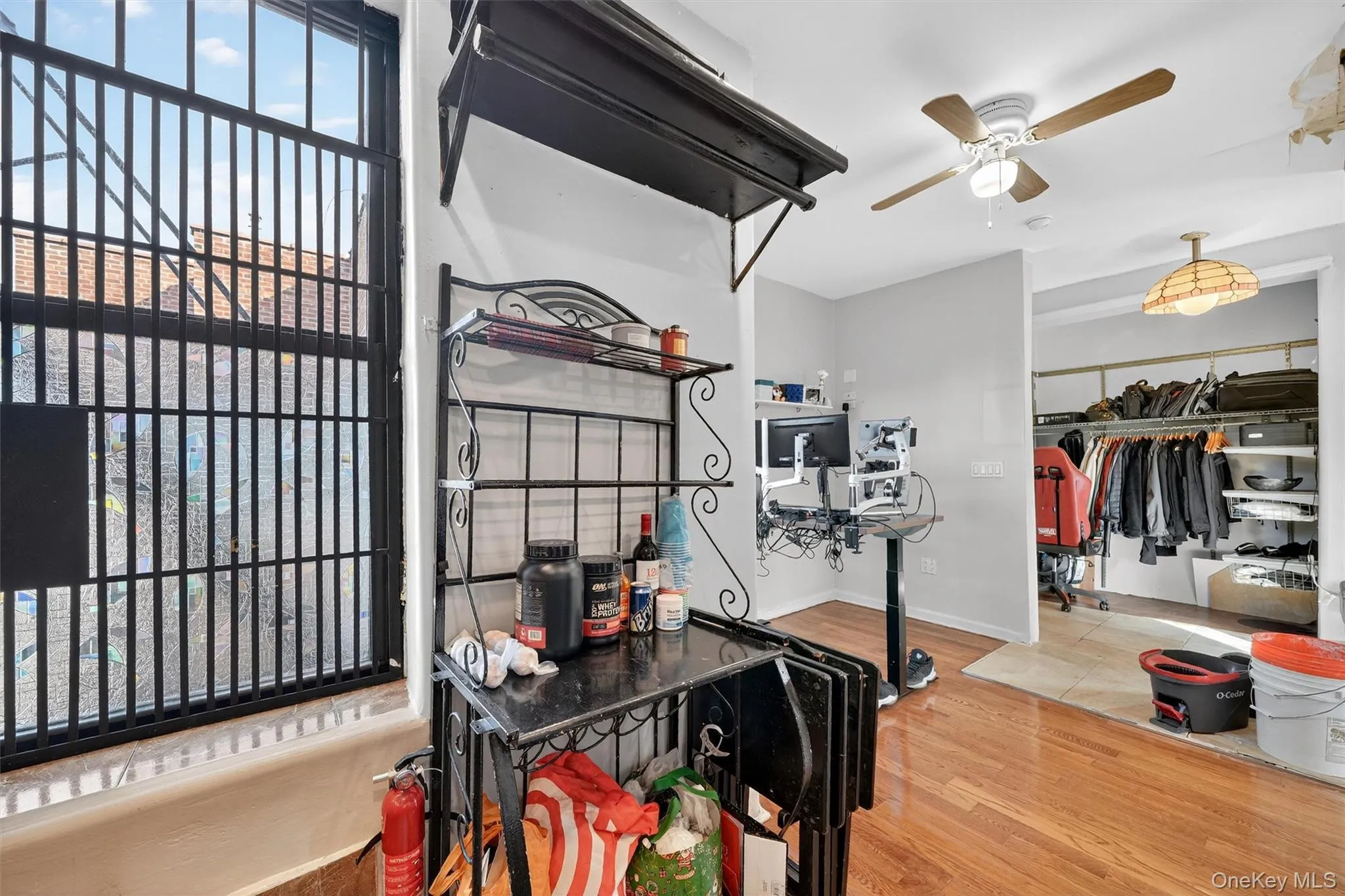Bedroom with light wood-style floors, a closet, and ceiling fan Bedroom with light wood-style floors, a closet, and ceiling fan