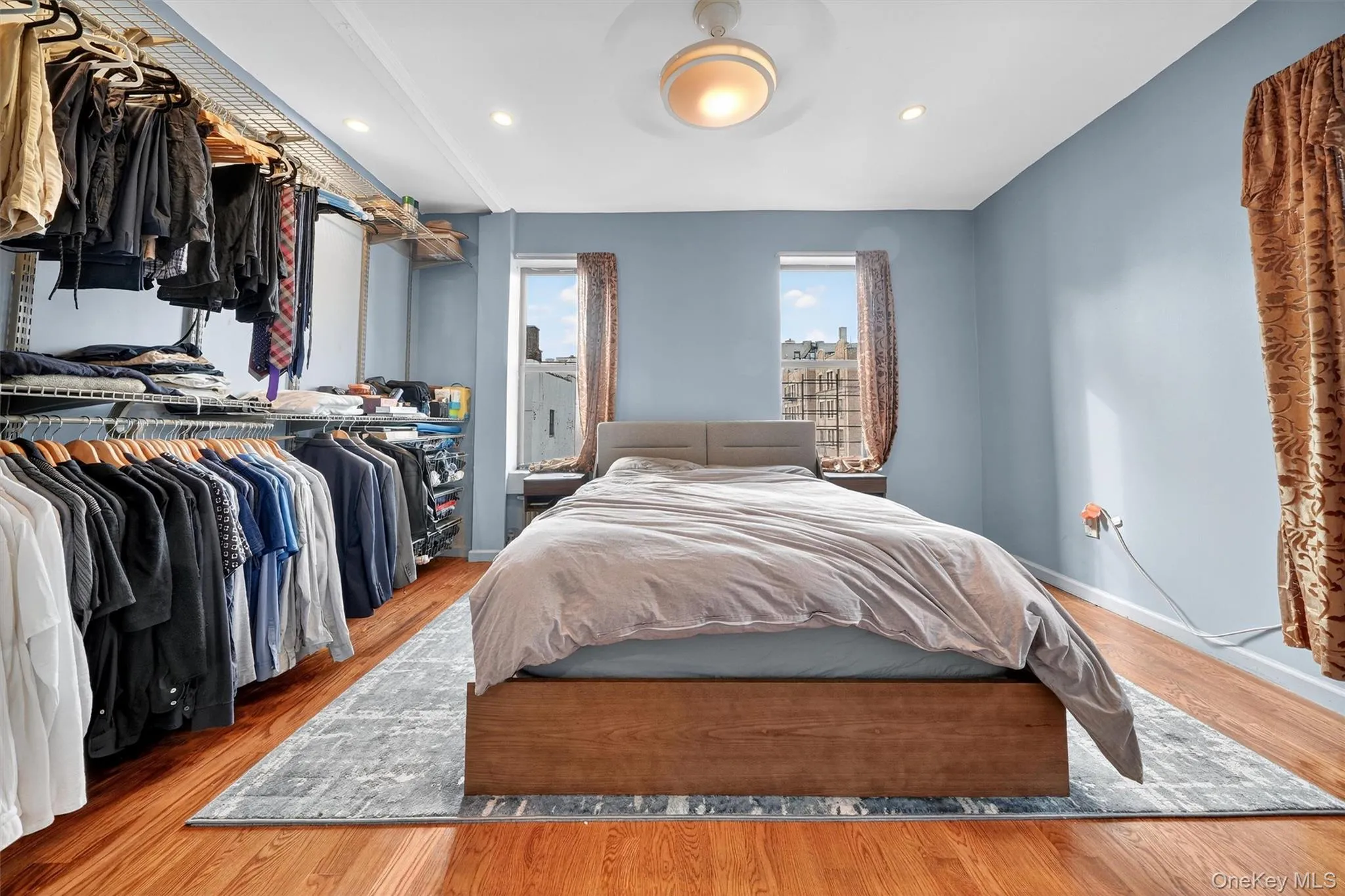 Bedroom with wood finished floors and recessed lighting Bedroom with wood finished floors and recessed lighting