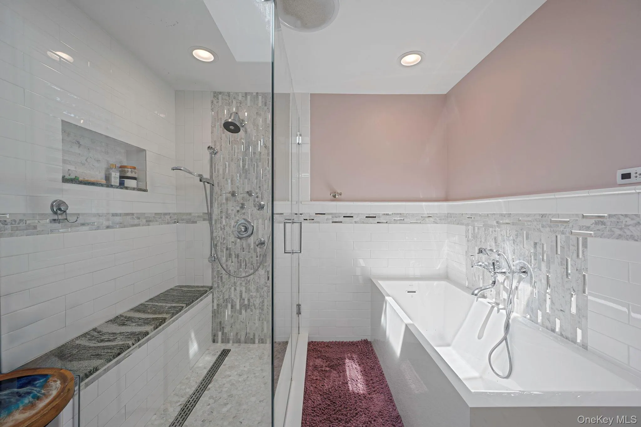 Full bathroom featuring a shower stall, a bath, tile walls, and recessed lighting Full bathroom featuring a shower stall, a bath, tile walls, and recessed lighting