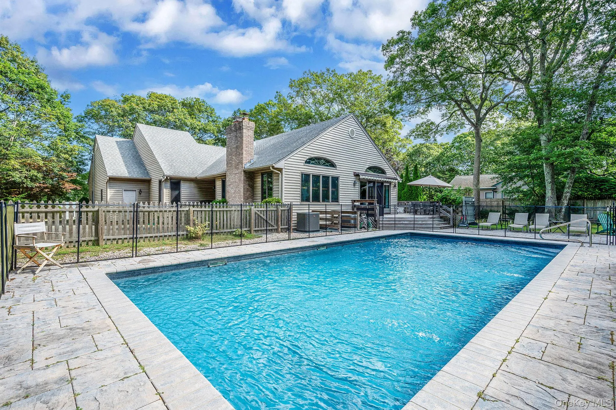 View of swimming pool with a patio View of swimming pool with a patio