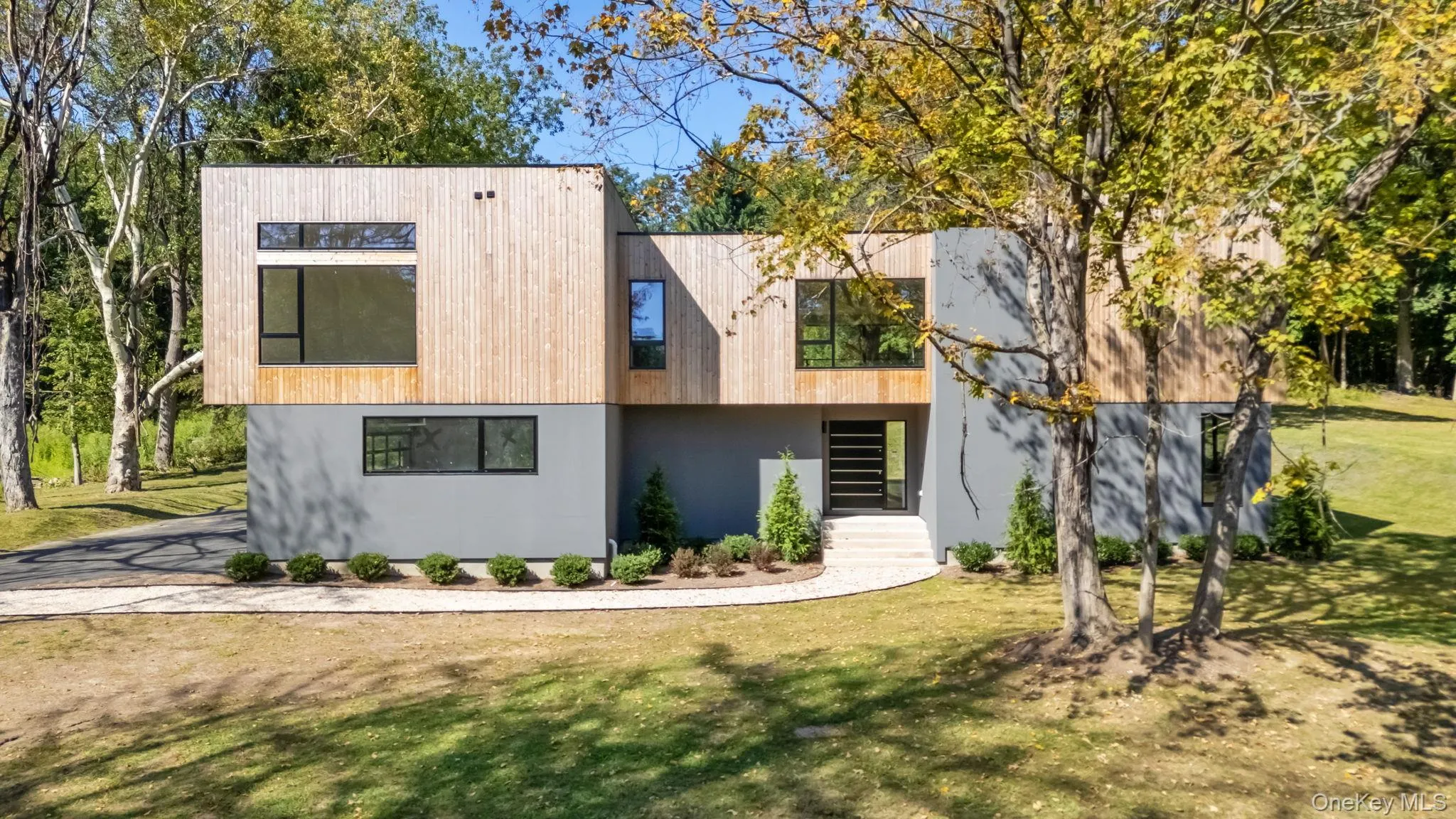 Contemporary house with a front yard Contemporary house with a front yard