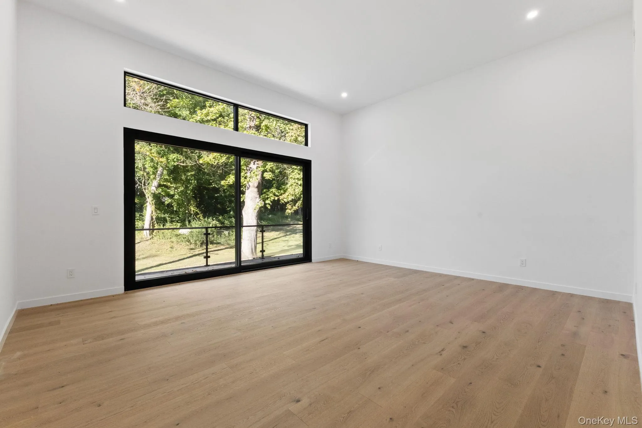Empty room featuring light wood-style floors and recessed lighting Empty room featuring light wood-style floors and recessed lighting
