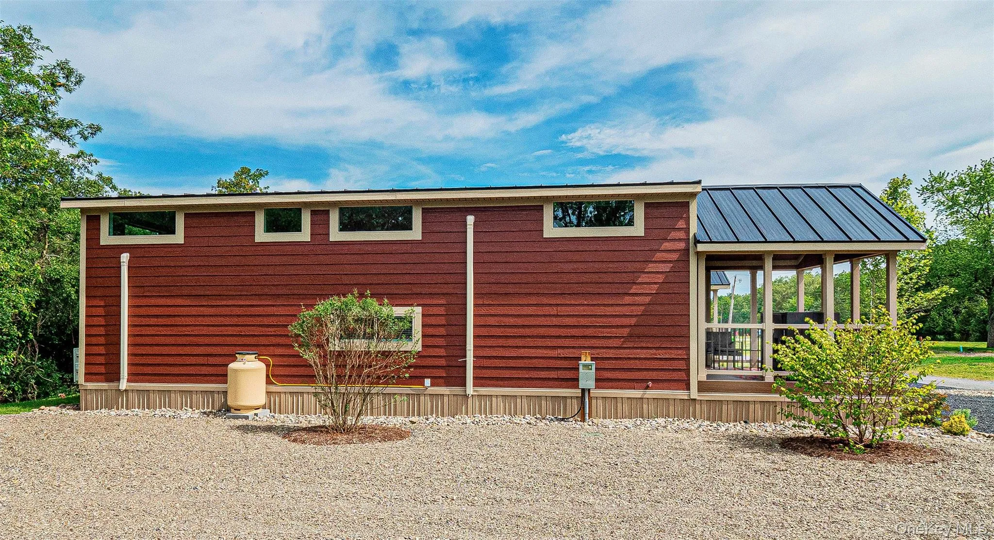 View of home's exterior featuring a metal roof View of home's exterior featuring a metal roof