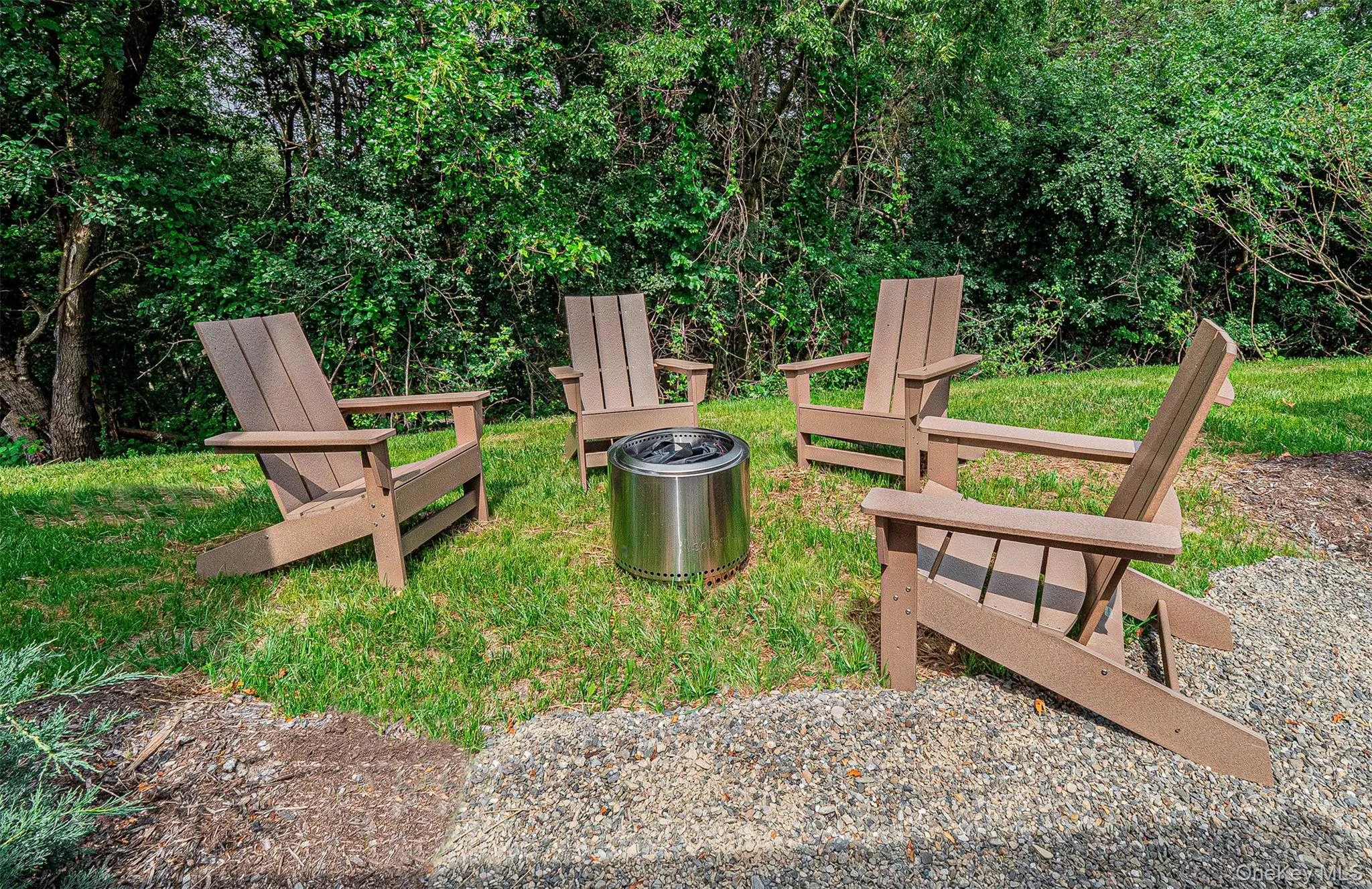 Patio area with space for smokeless fire pit and lawn chairs Patio area with space for smokeless fire pit and lawn chairs