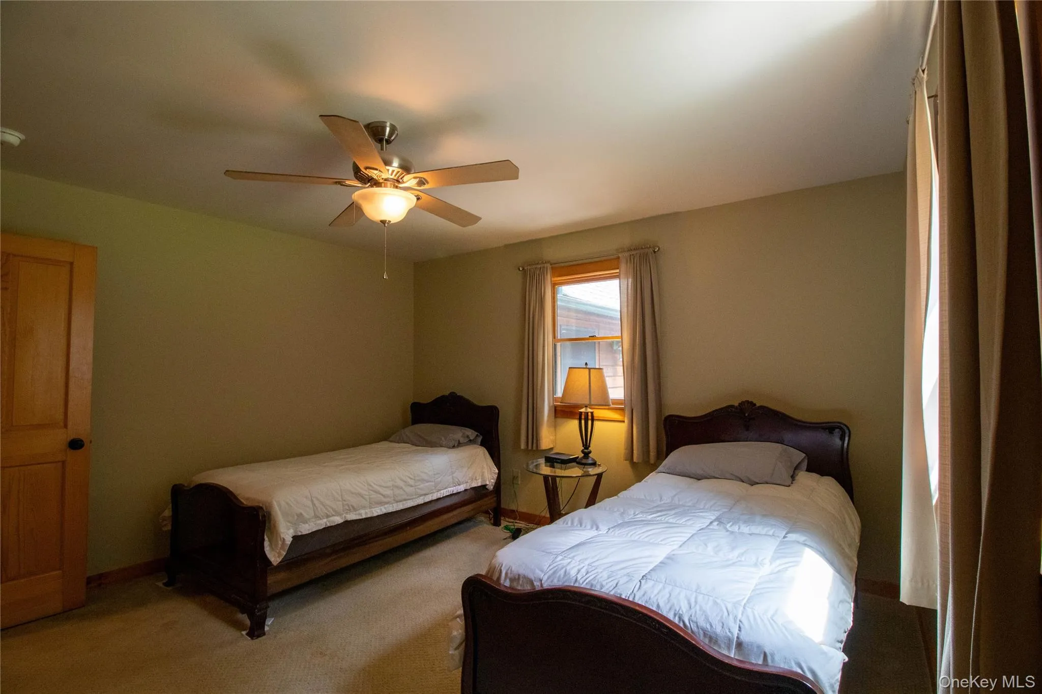 Bedroom with carpet and ceiling fan Bedroom with carpet and ceiling fan