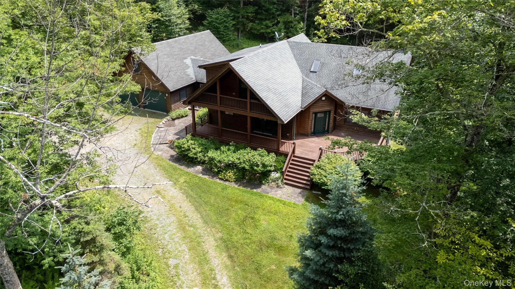 View from above of property featuring a tree filled landscape View from above of property featuring a tree filled landscape
