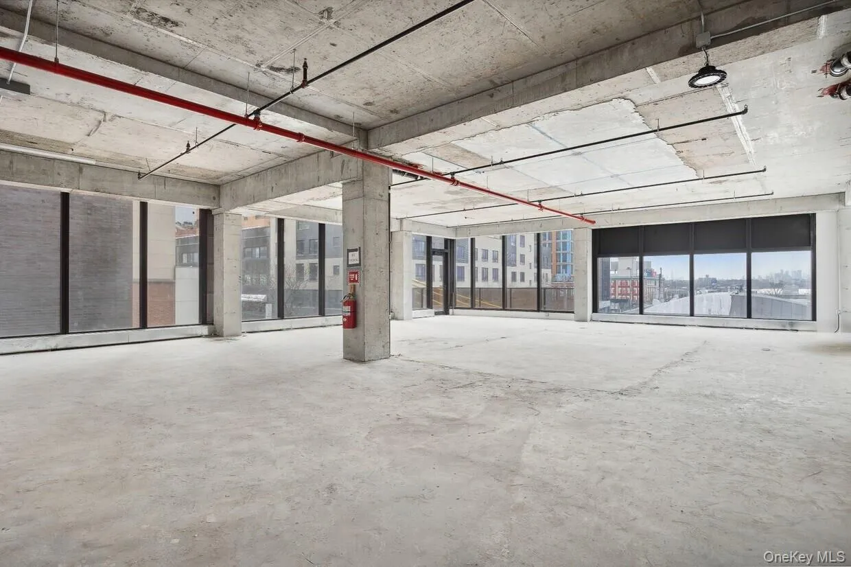 Spare room featuring concrete floors Spare room featuring concrete floors