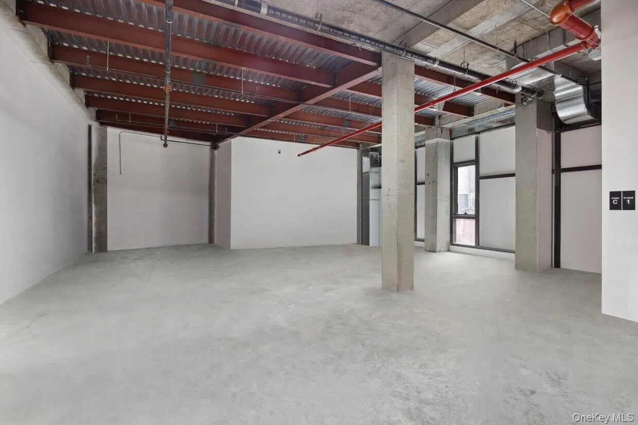 Basement featuring a garage Basement featuring a garage