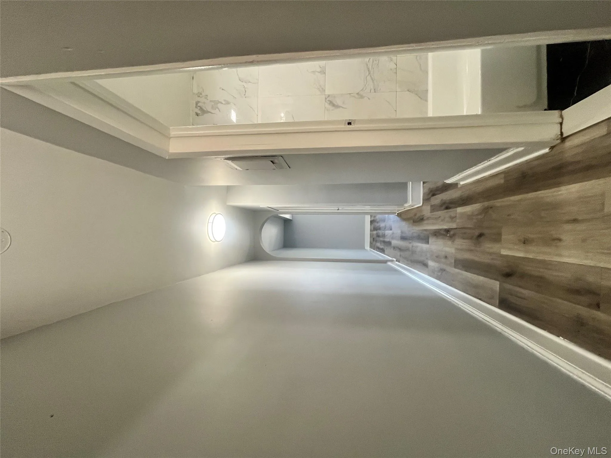 Corridor with dark wood finished floors and arched walkways Corridor with dark wood finished floors and arched walkways