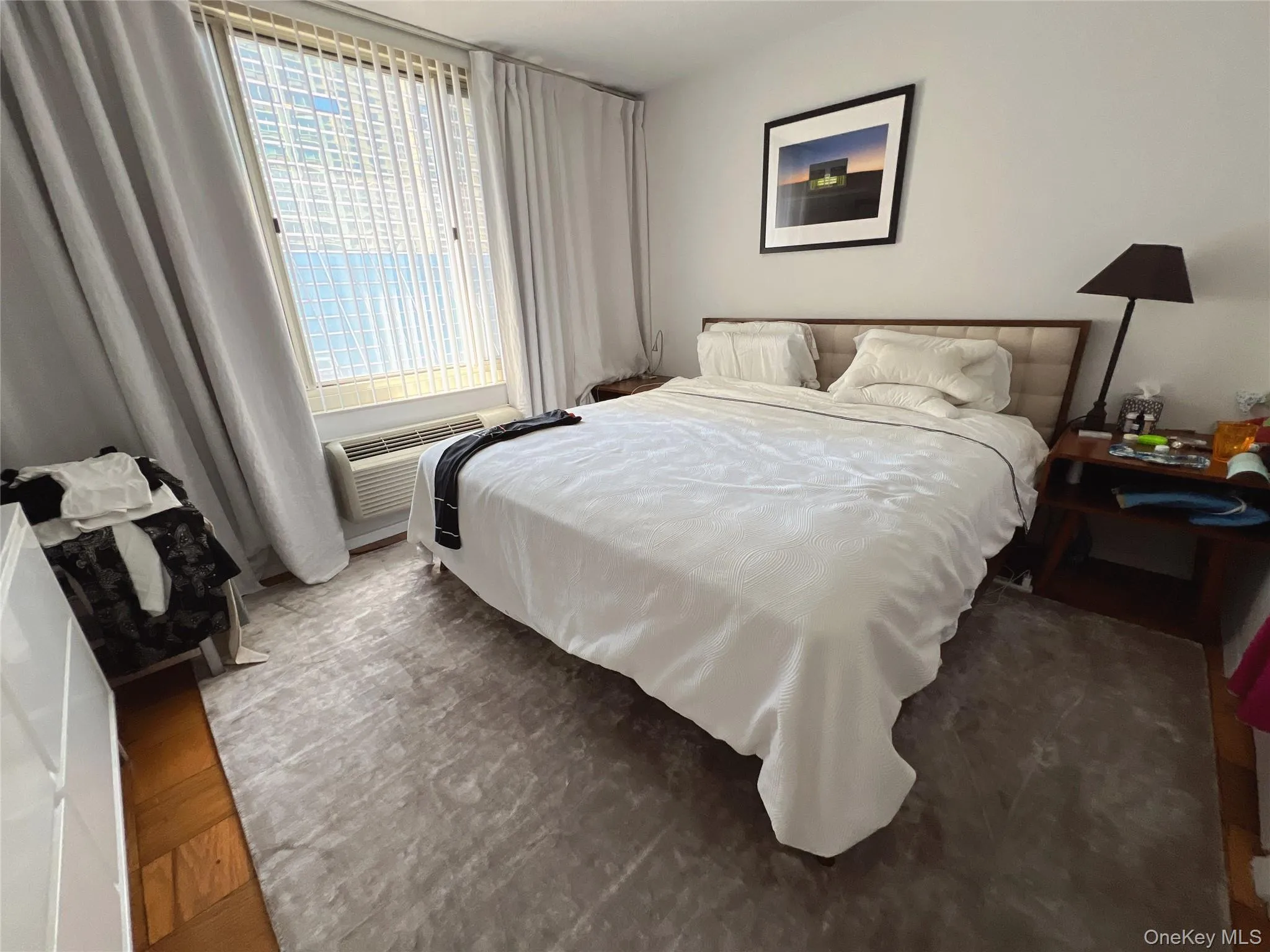 Bedroom featuring wood finished floors Bedroom featuring wood finished floors