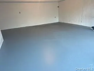 Spare room featuring concrete floors Spare room featuring concrete floors