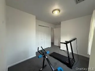 Workout area featuring baseboards Workout area featuring baseboards