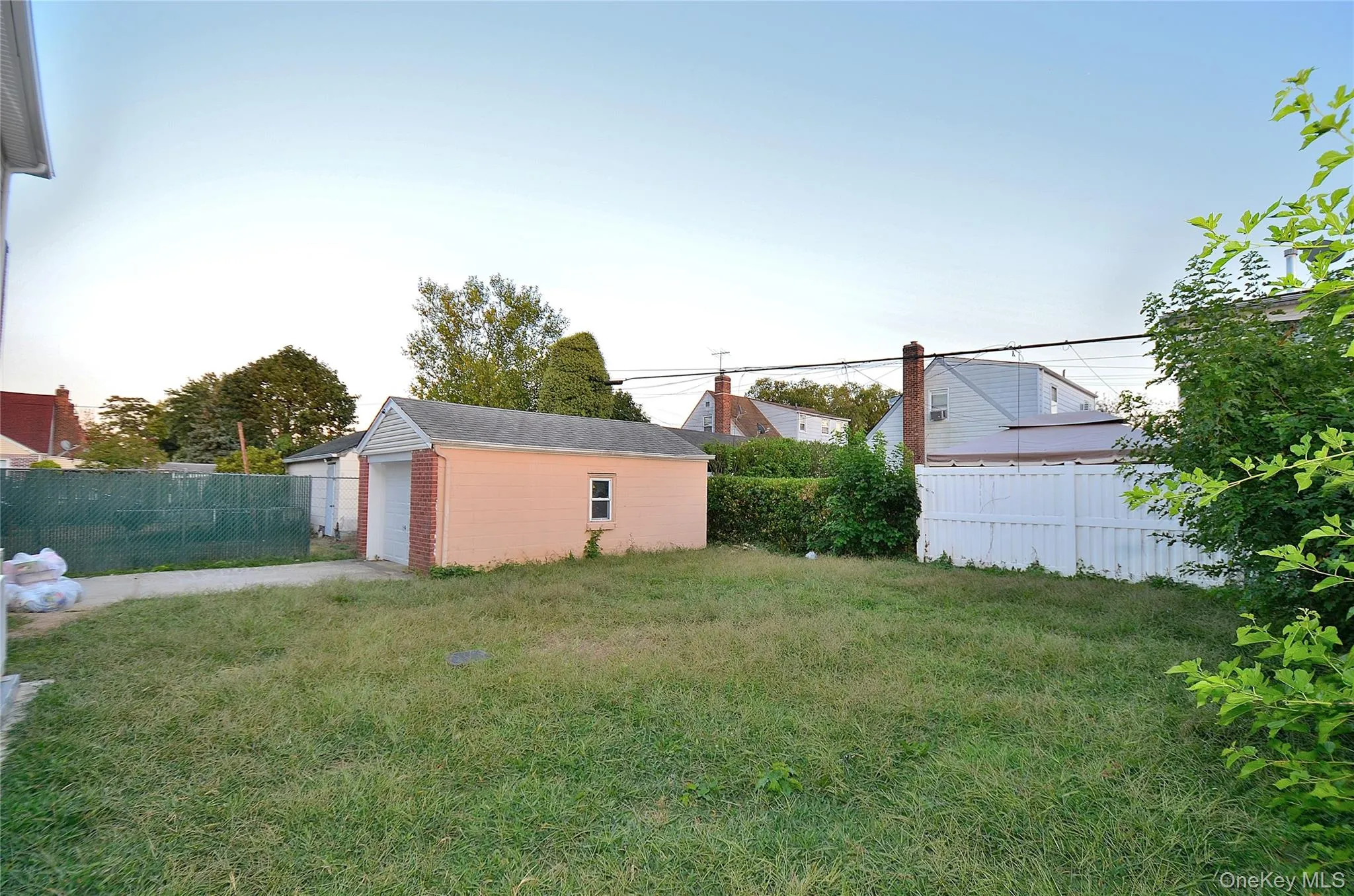 View of yard with an outbuilding and a garage View of yard with an outbuilding and a garage