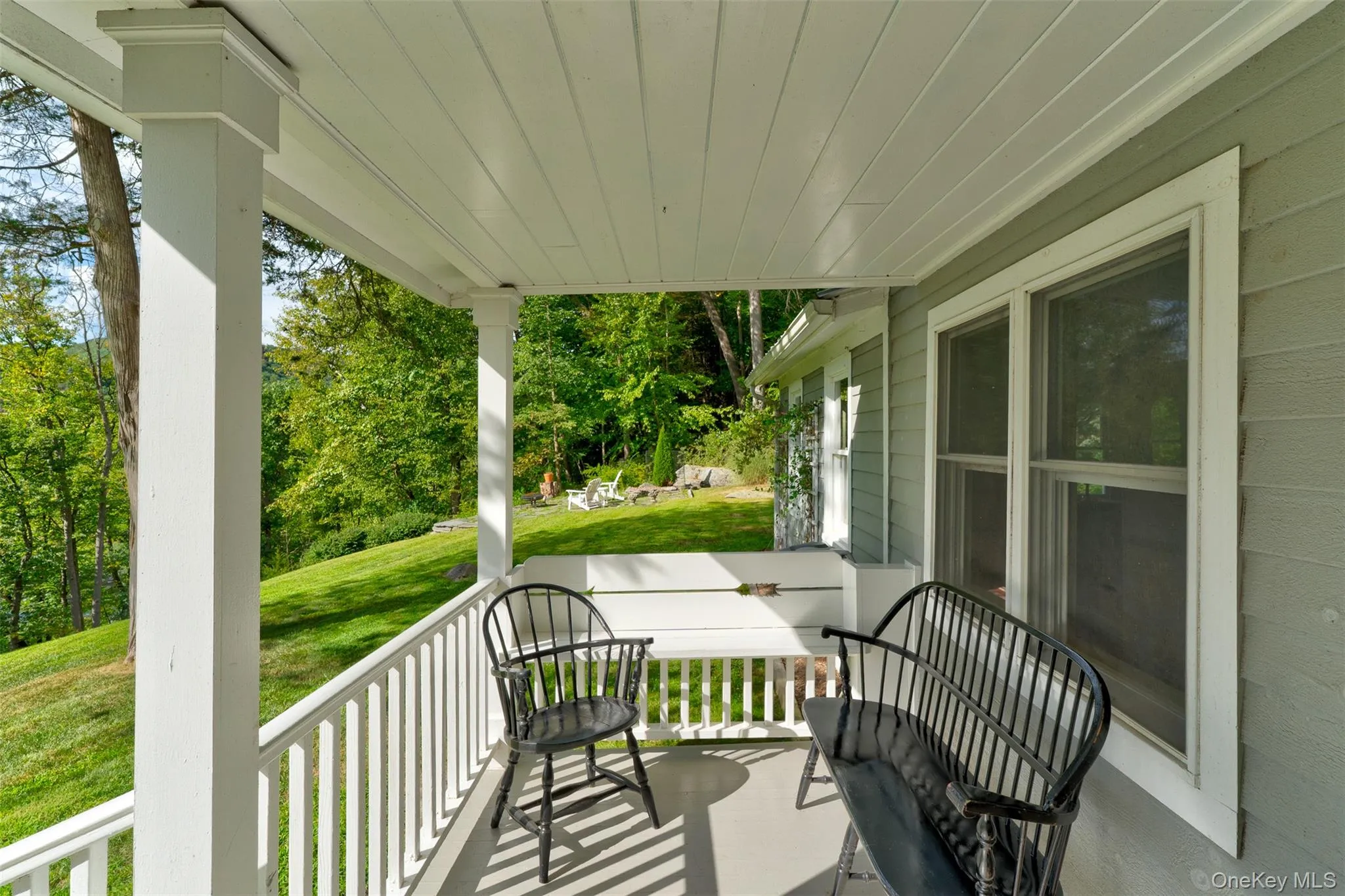 Porch featuring a yard Porch featuring a yard