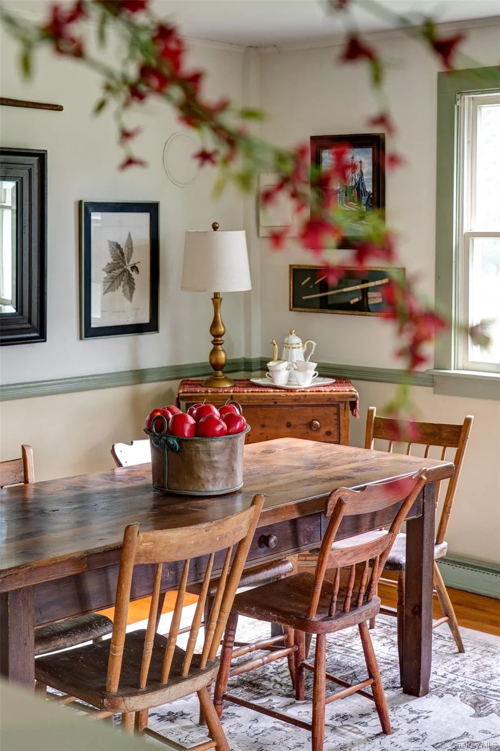 Dining space with baseboard heating and wood finished floors Dining space with baseboard heating and wood finished floors