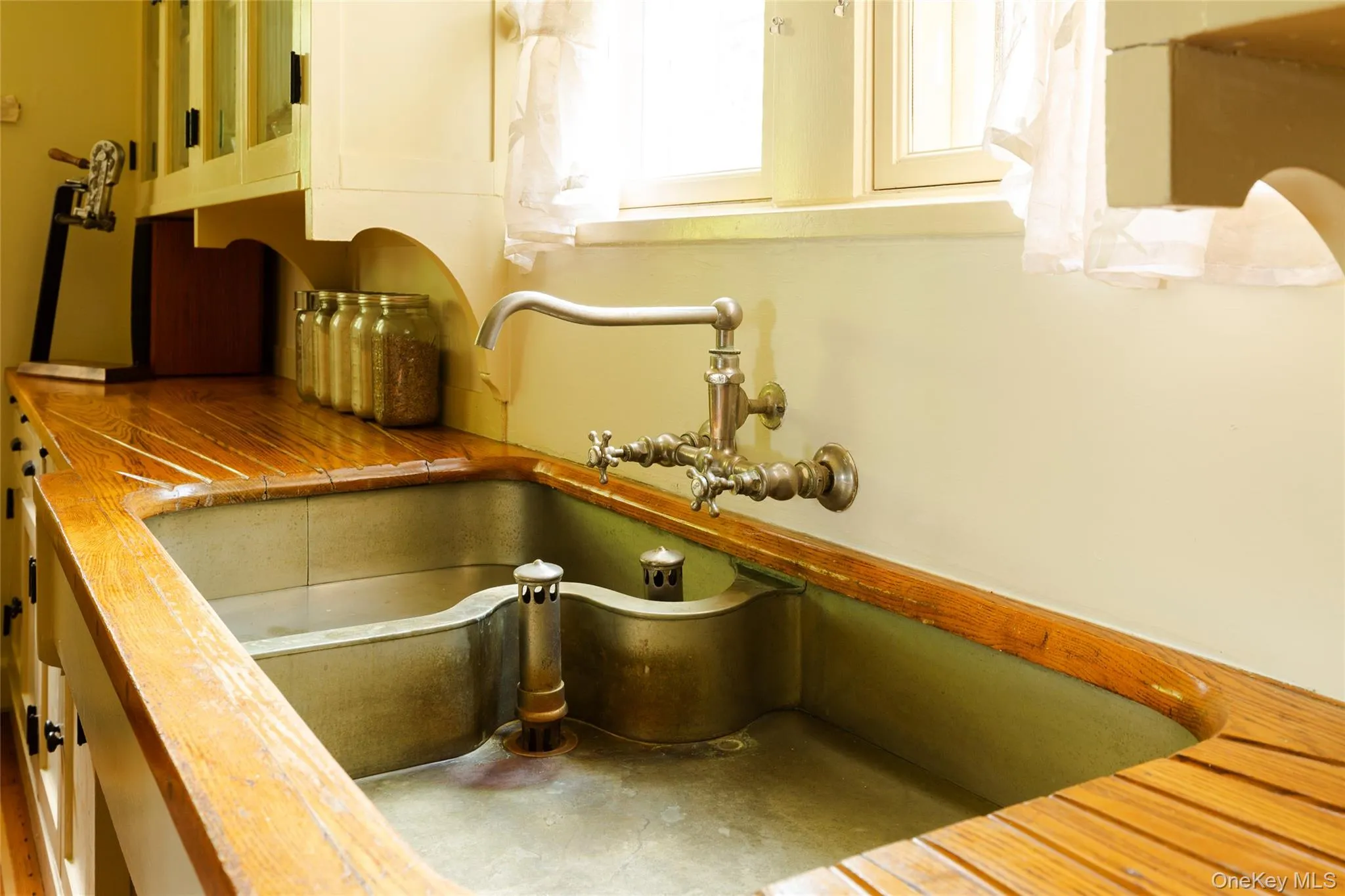 Kitchen view of butcher block countertops and a sink Kitchen view of butcher block countertops and a sink