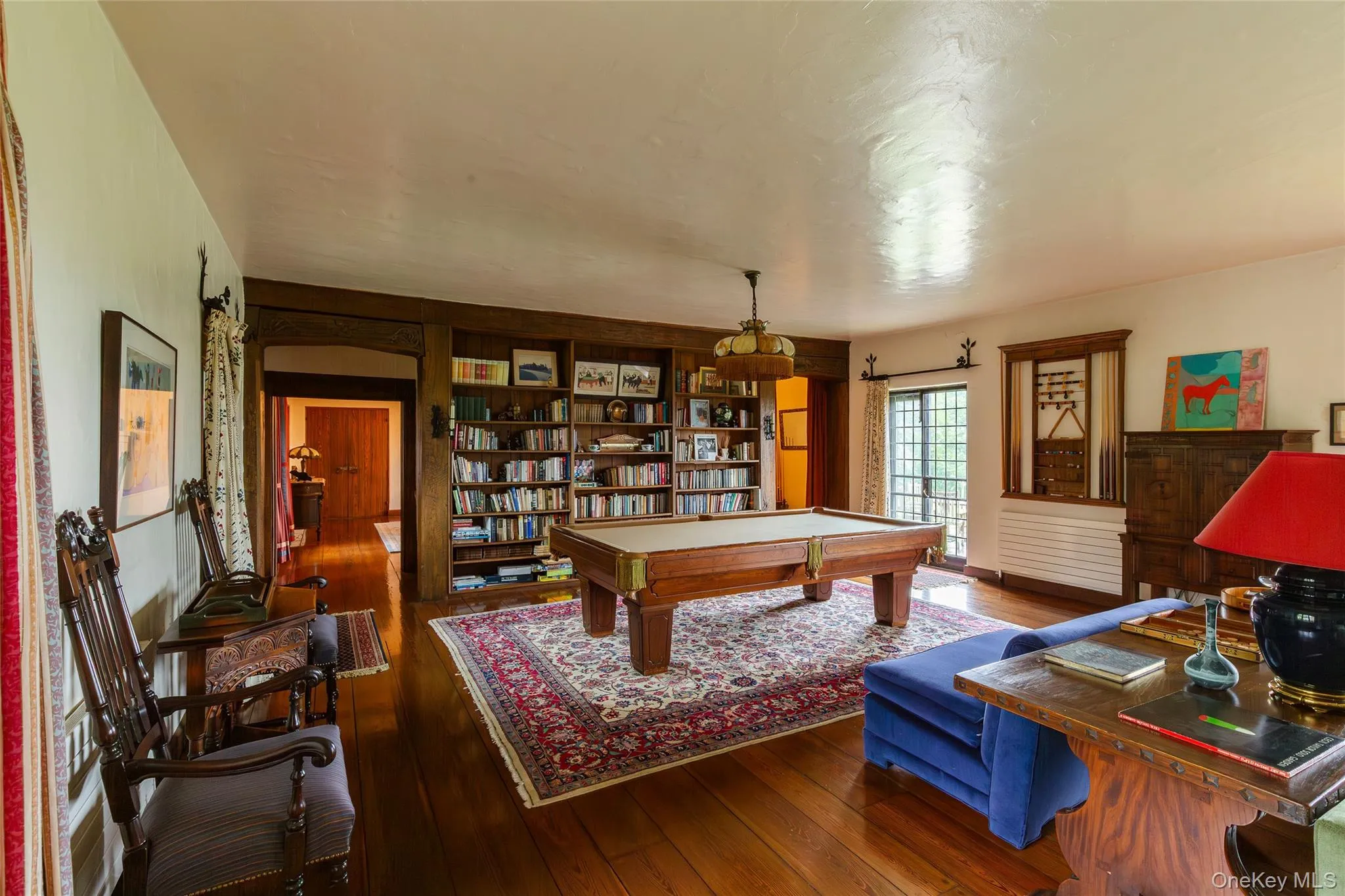 Playroom featuring hardwood / wood-style flooring and billiards Playroom featuring hardwood / wood-style flooring and billiards