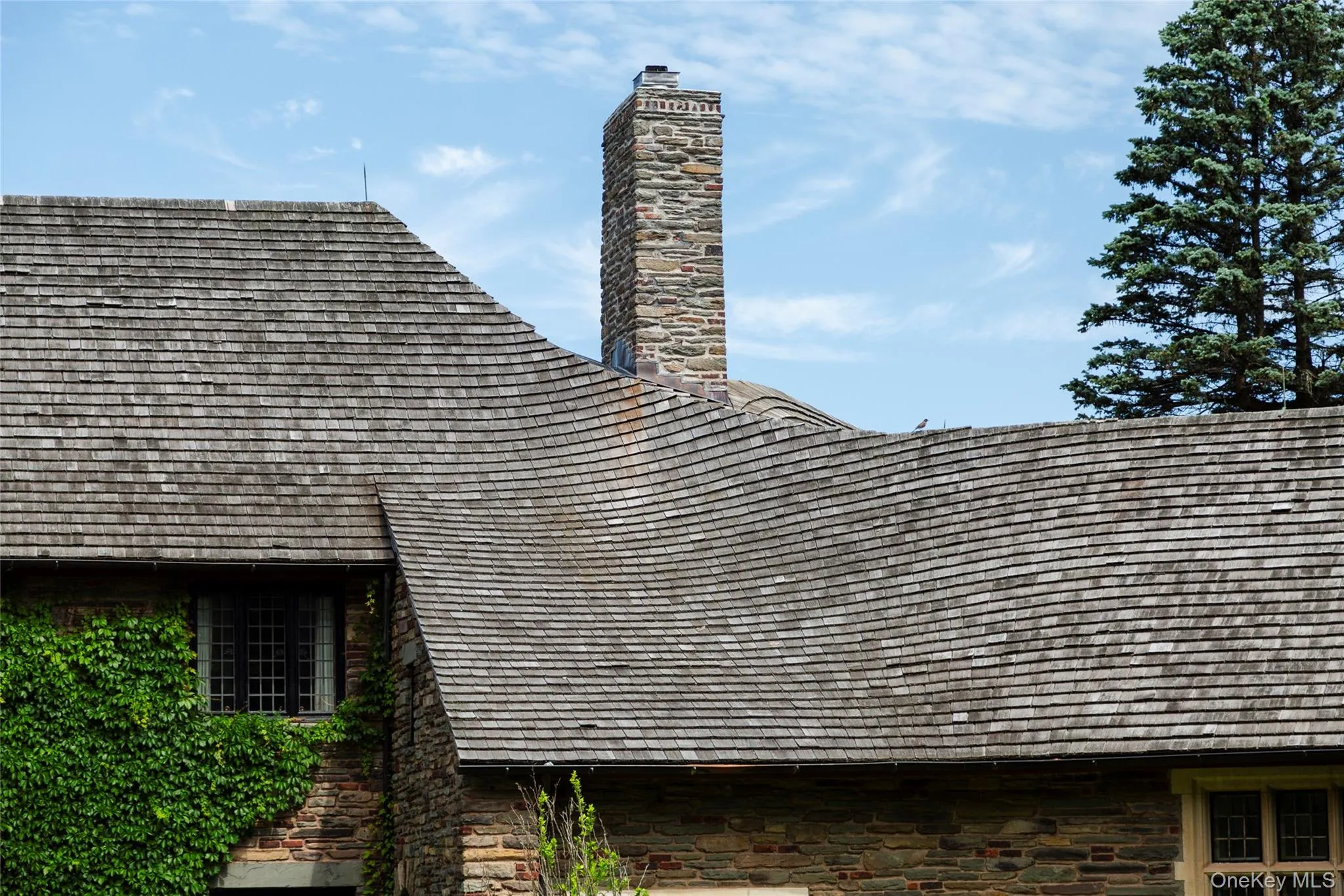 Exterior view of stone siding and a chimney Exterior view of stone siding and a chimney