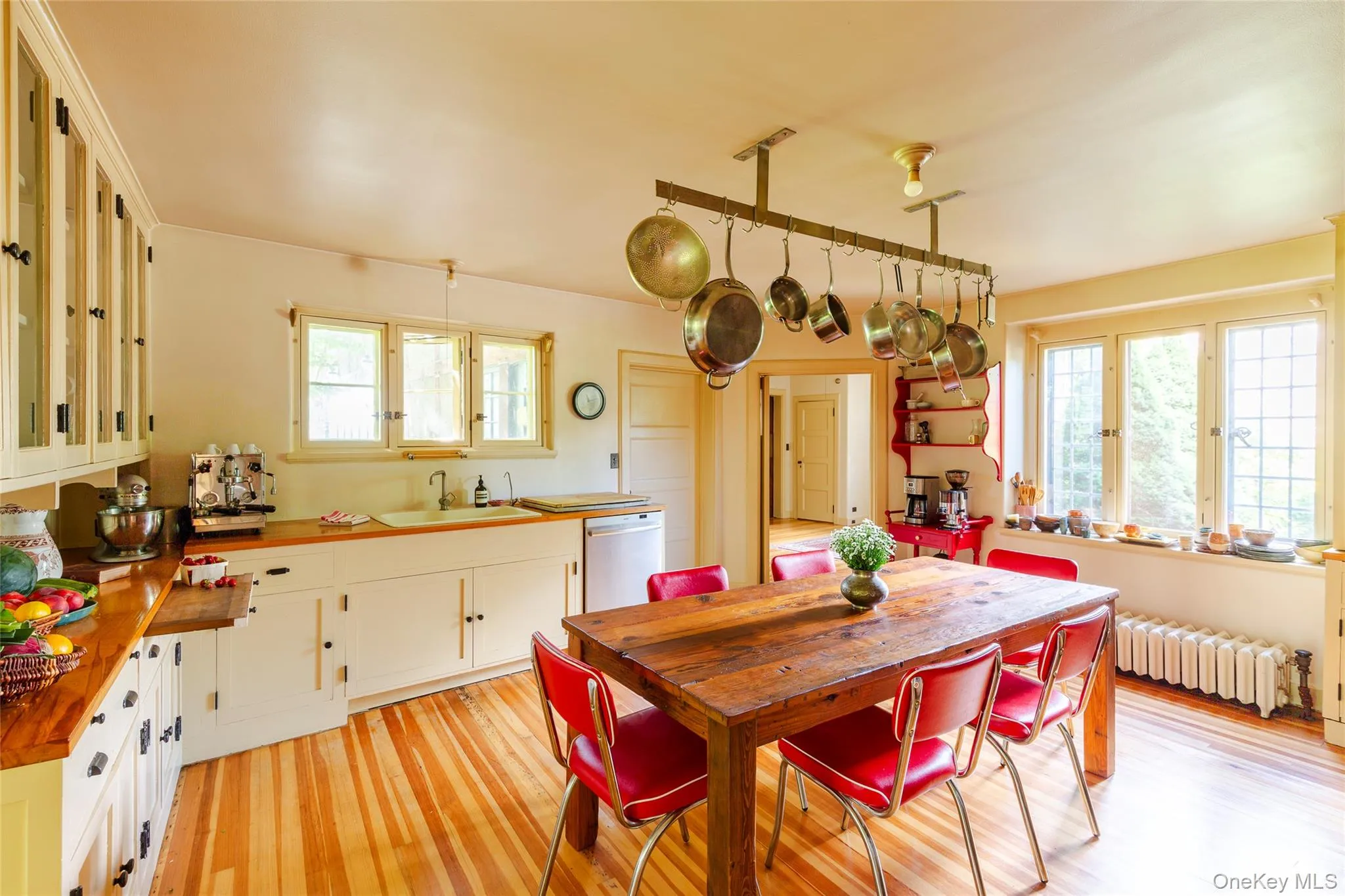 Dining area featuring light wood-style flooring and radiator Dining area featuring light wood-style flooring and radiator