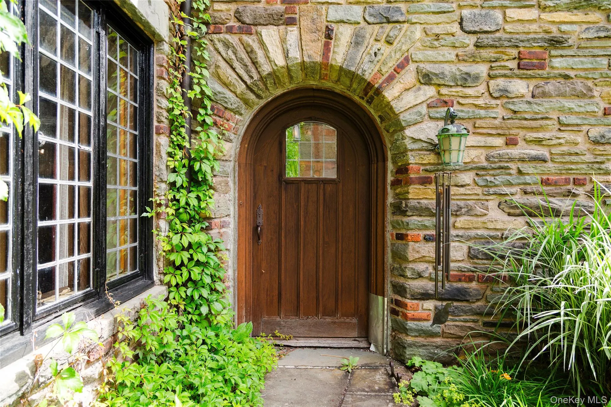Property entrance featuring stone siding Property entrance featuring stone siding