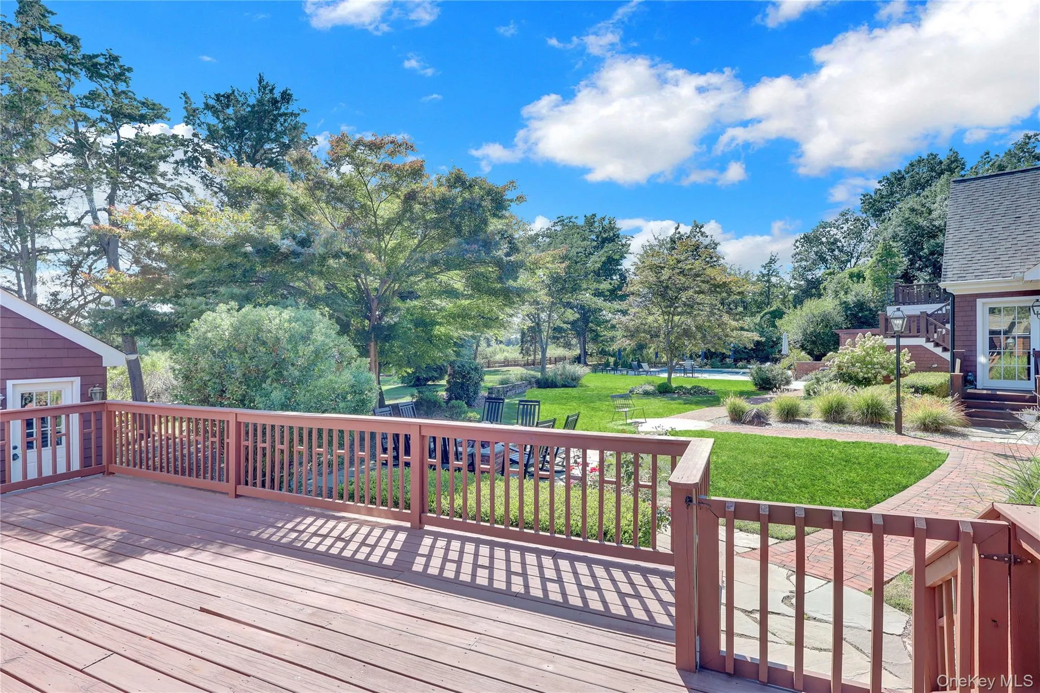 Wooden deck featuring a lawn Wooden deck featuring a lawn