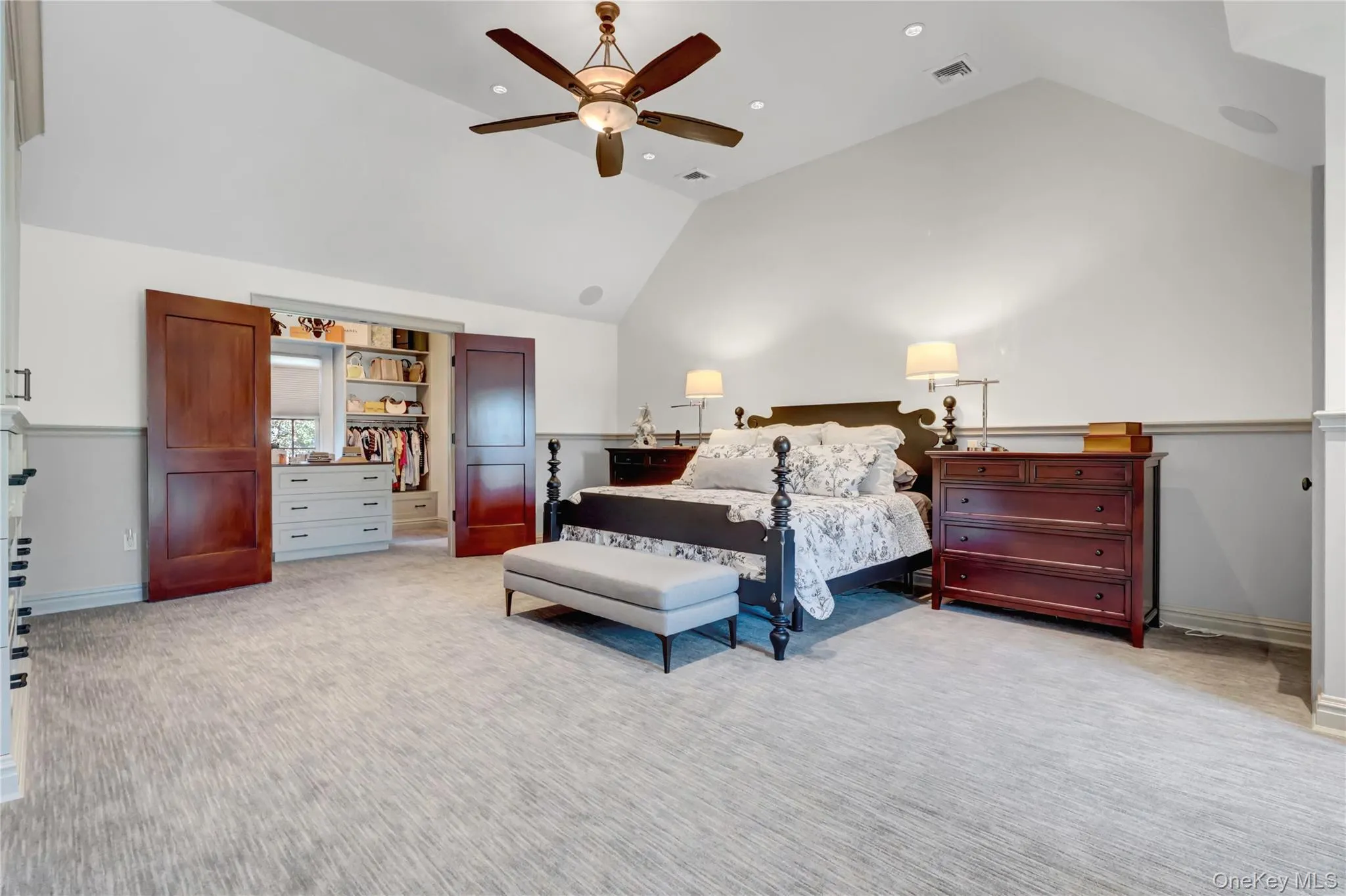 Bedroom featuring high vaulted ceiling, light colored carpet, ceiling fan, and recessed lighting Bedroom featuring high vaulted ceiling, light colored carpet, ceiling fan, and recessed lighting