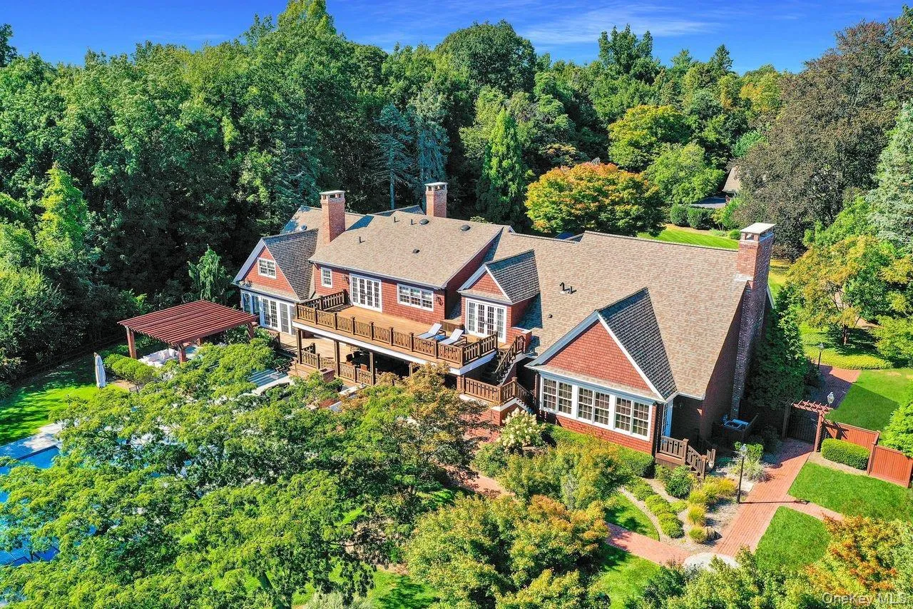 Aerial view of property and surrounding area featuring a heavily wooded area Aerial view of property and surrounding area featuring a heavily wooded area