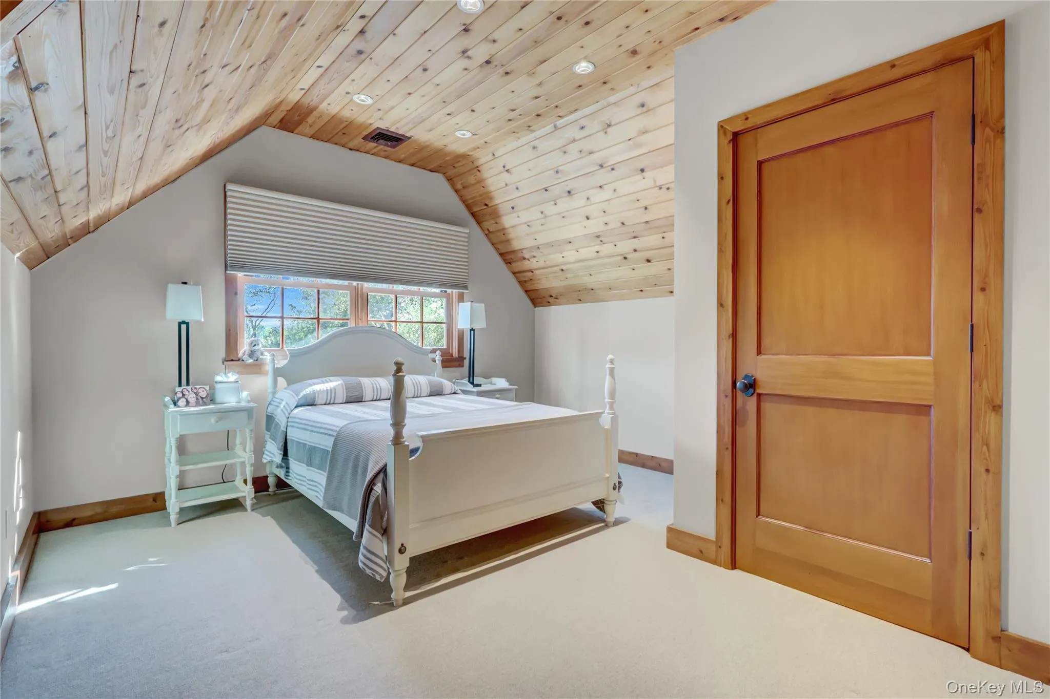 Carpeted bedroom with wood ceiling, vaulted ceiling, and recessed lighting Carpeted bedroom with wood ceiling, vaulted ceiling, and recessed lighting