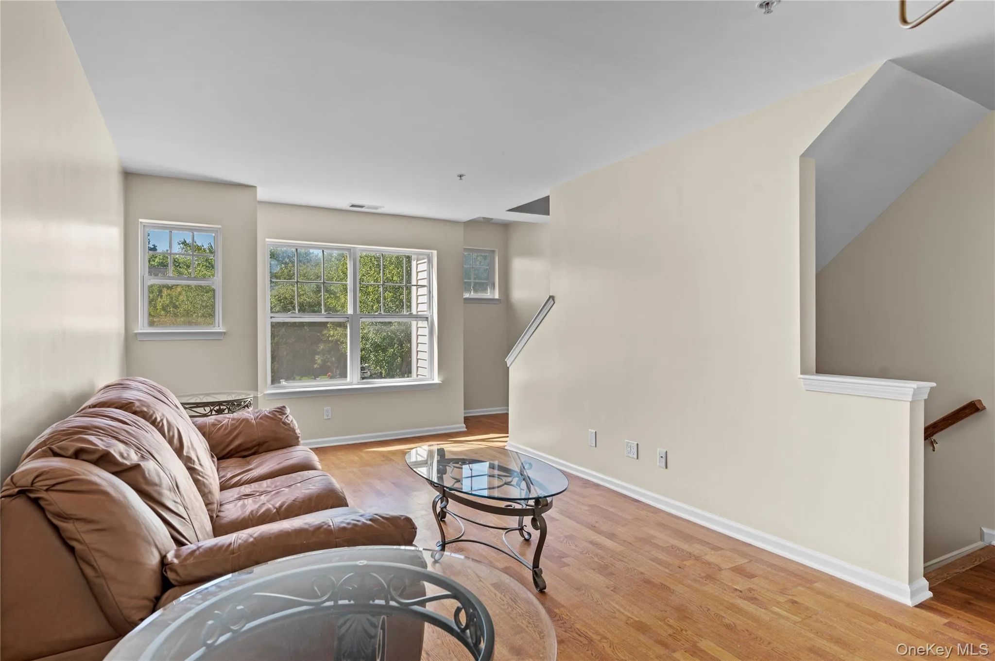 Living area with wood finished floors Living area with wood finished floors