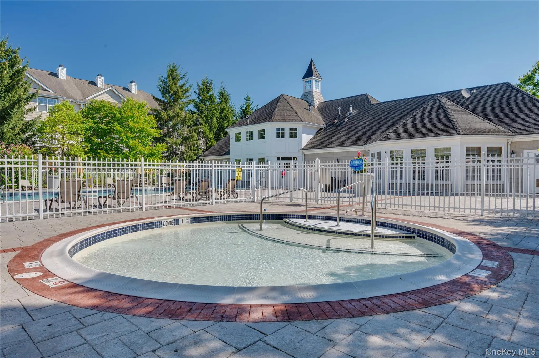 Community pool with a patio Community pool with a patio
