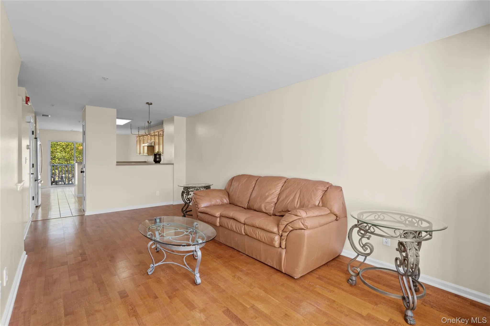 Living area with wood finished floors and baseboards Living area with wood finished floors and baseboards