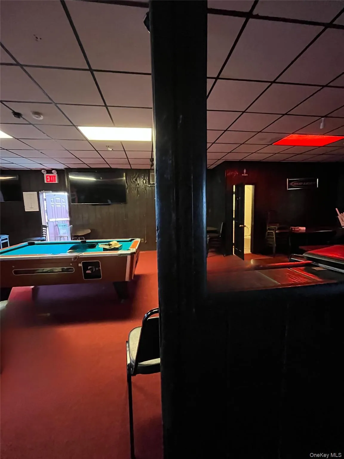Game room with a drop ceiling, billiards, and carpet flooring Game room with a drop ceiling, billiards, and carpet flooring