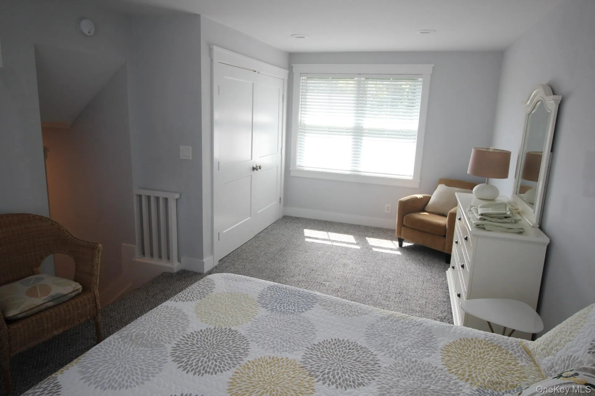 Bedroom with carpet and a closet Bedroom with carpet and a closet