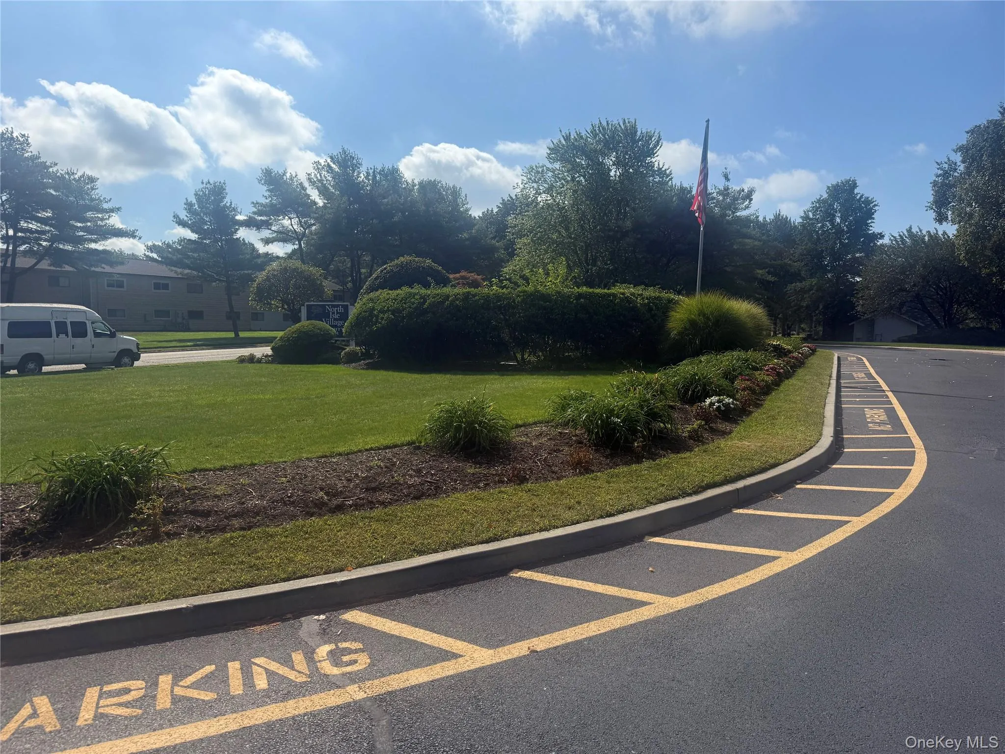 View of asphalt road featuring curbs View of asphalt road featuring curbs