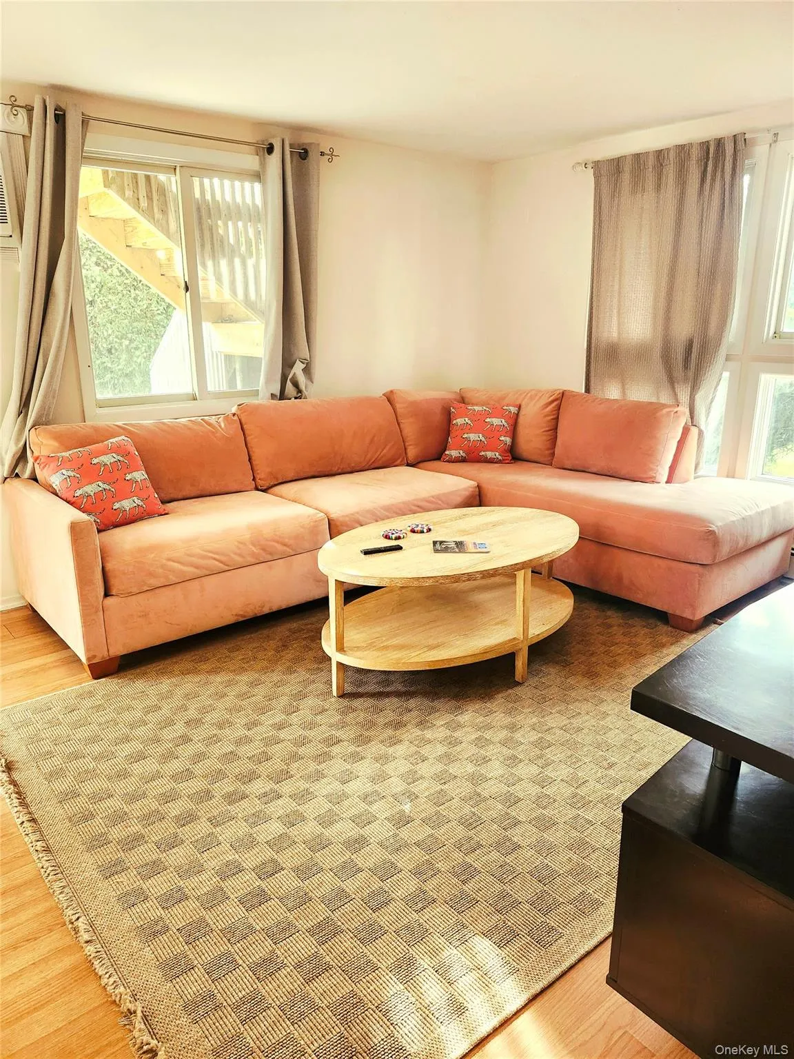 Living area with light wood-style floors Living area with light wood-style floors