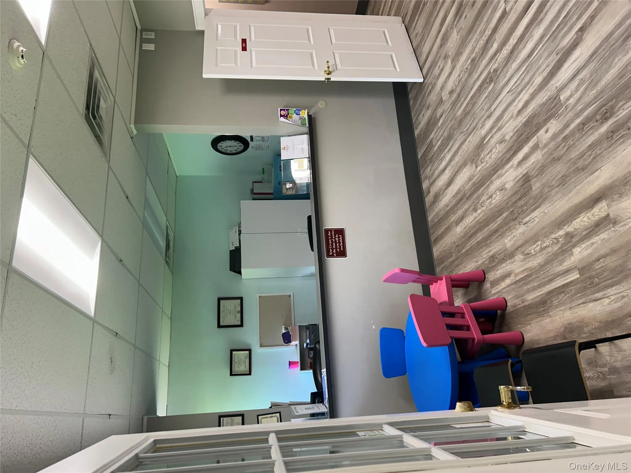 Reception featuring a drop ceiling Reception featuring a drop ceiling