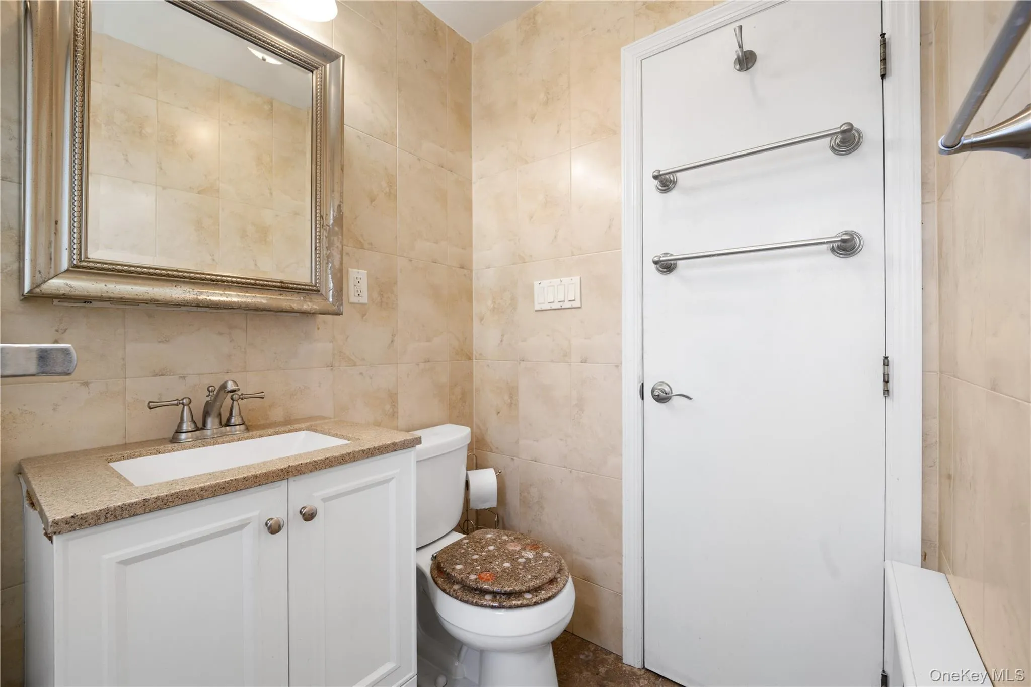 Bathroom with vanity and tile walls Bathroom with vanity and tile walls