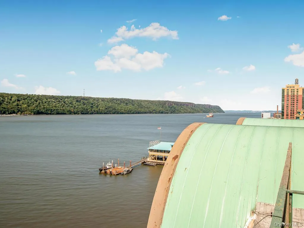 Water view featuring a floating dock Water view featuring a floating dock