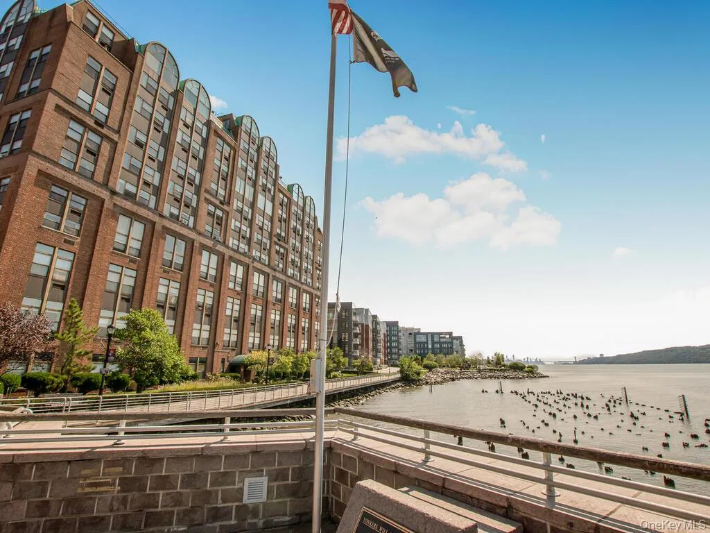 View of apartment building / complex featuring a water view and a view of city View of apartment building / complex featuring a water view and a view of city