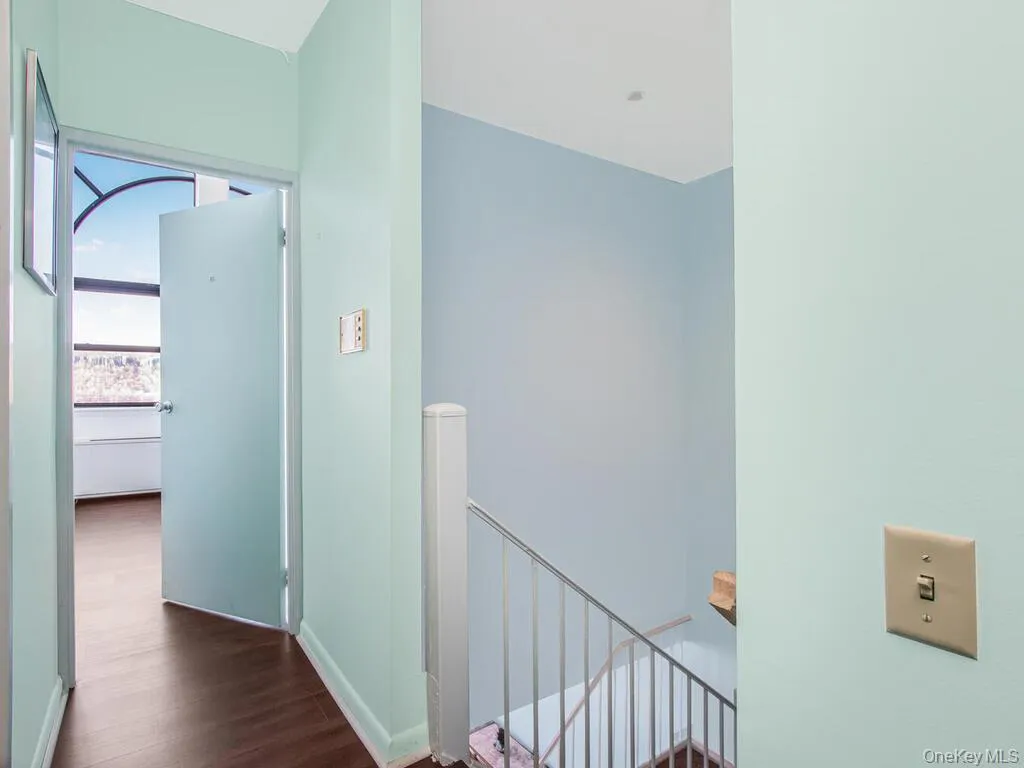 Hallway ,upstairs landing and dark wood-style floors Hallway ,upstairs landing and dark wood-style floors