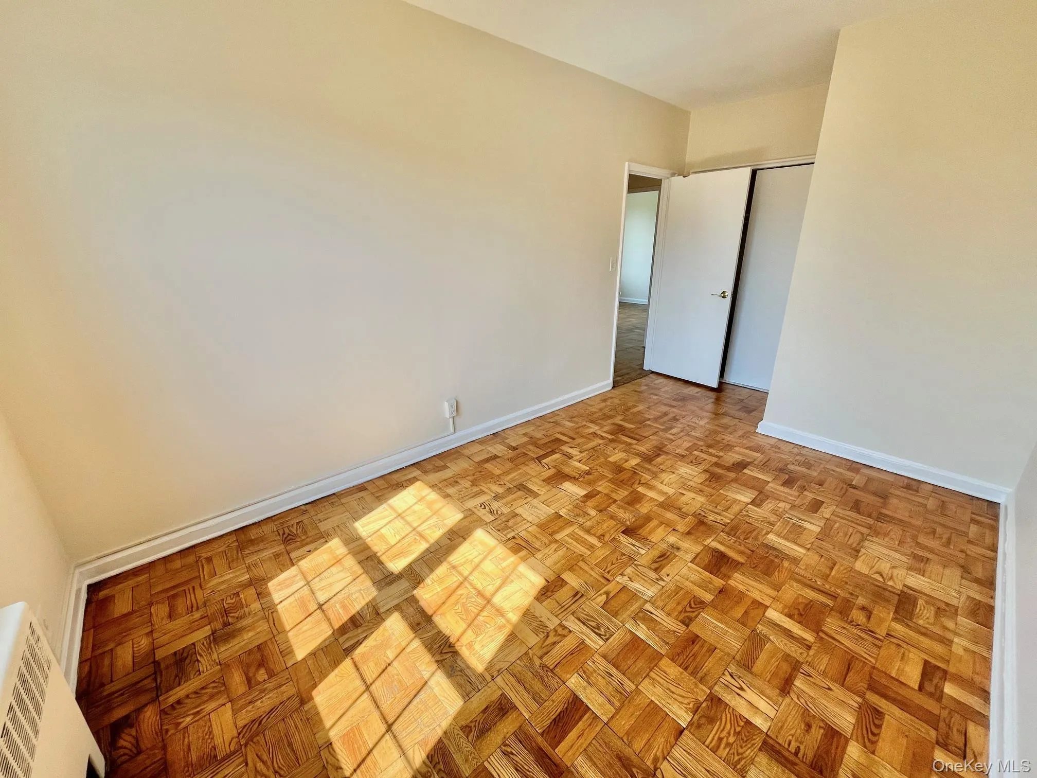 Unfurnished bedroom with baseboards and a closet Unfurnished bedroom with baseboards and a closet