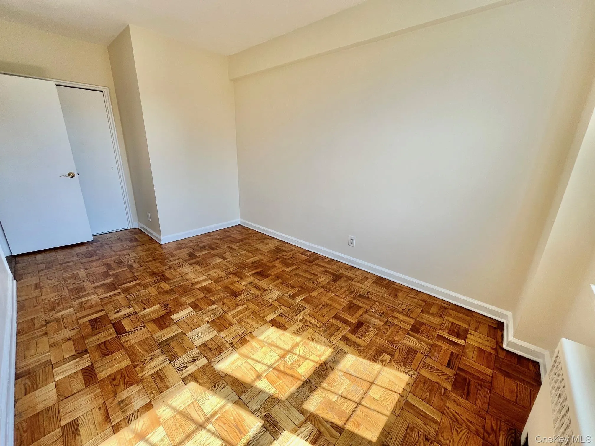 Unfurnished bedroom with a closet and baseboards Unfurnished bedroom with a closet and baseboards