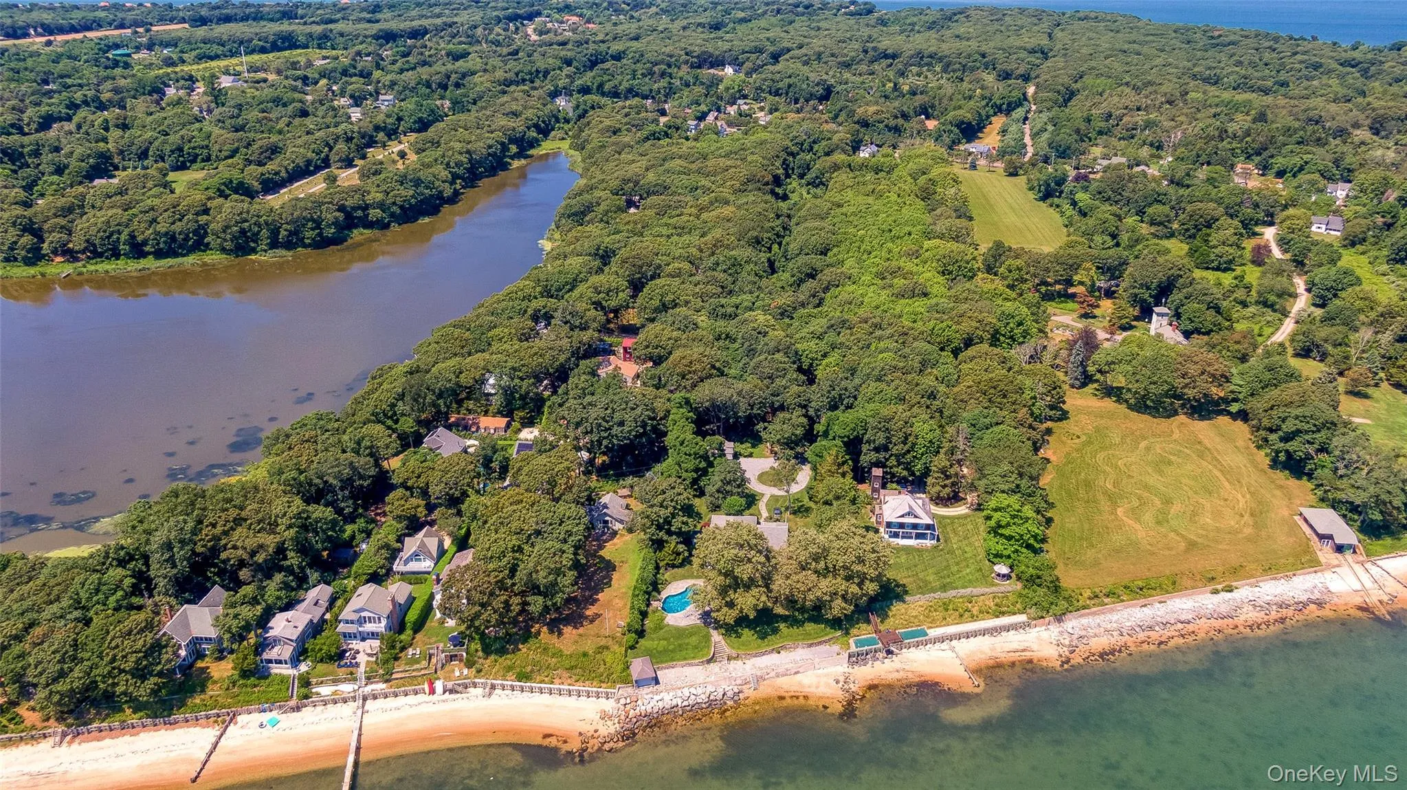 Aerial view of property and surrounding area featuring a large body of water Aerial view of property and surrounding area featuring a large body of water
