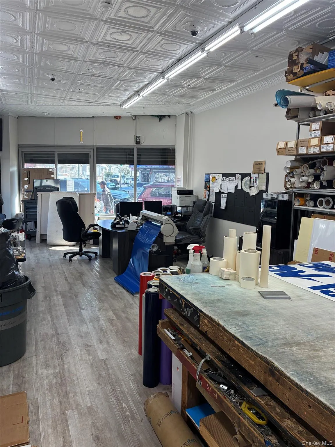 Dining room with wood finished floors and an ornate ceiling Dining room with wood finished floors and an ornate ceiling