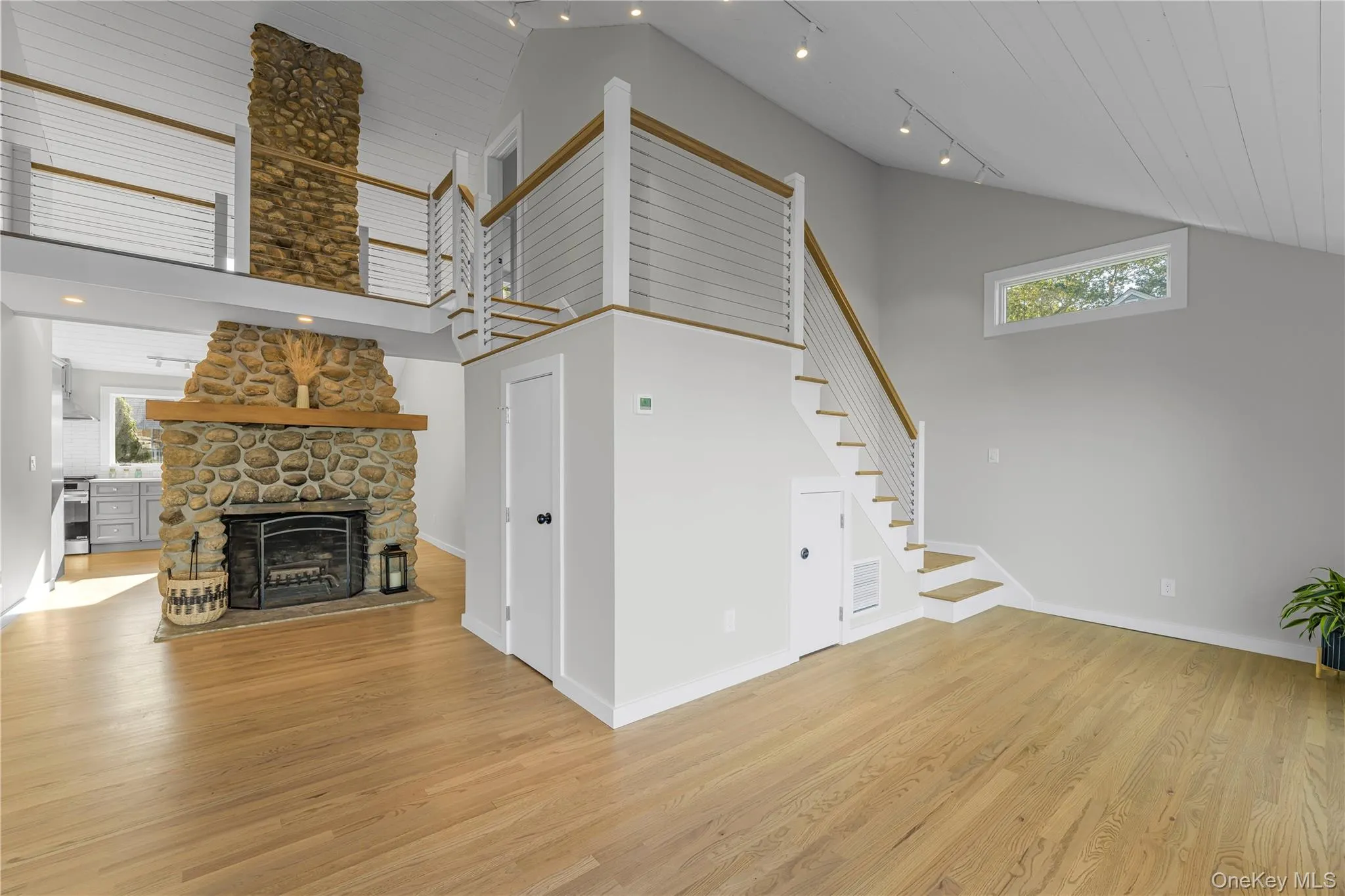 Fireplace and Stairs to 2nd Floor Fireplace and Stairs to 2nd Floor