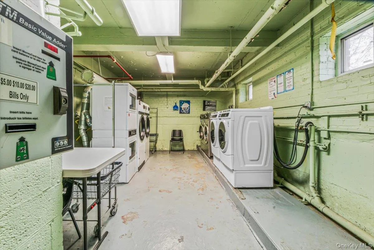 Shared laundry room featuring washer and dryer Shared laundry room featuring washer and dryer